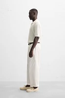 POLO EN MAILLE TEXTURÉE OUVERTE
