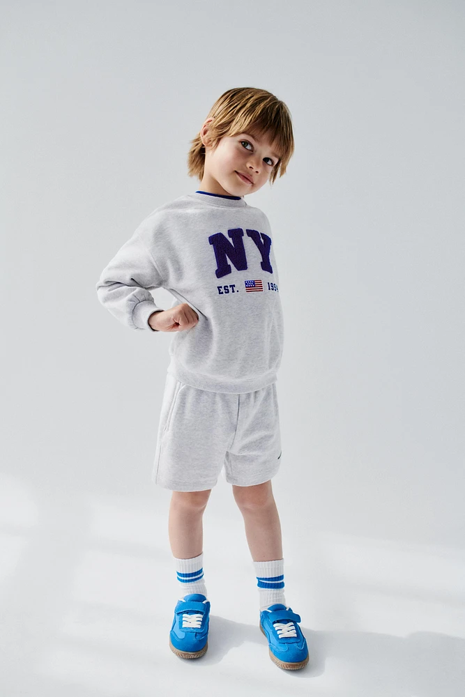 SWEAT PIÈCE EN VELOURS BOUCLÉ