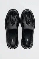 PATENT FINISH TASSELED LOAFERS