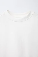 T-SHIRT UNI SANS MANCHES ÉTIQUETTE