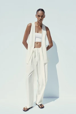 GILET LONG FENTES CEINTURE POSITIONS MULTIPLES