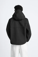 HOODED TECHNICAL JACKET