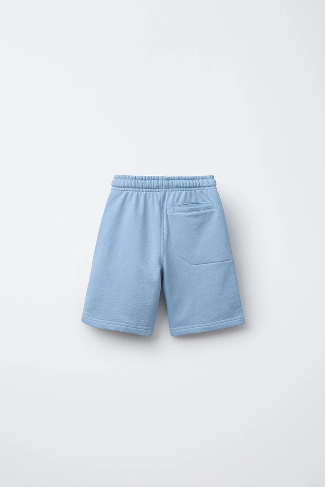 RAISED TEXT PLUSH SHORTS