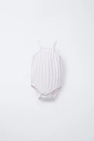 THREE-PACK OF RIB KNIT BODYSUITS WITH CUTOUT DETAIL