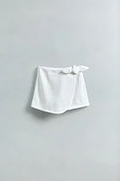 JUPE-SHORT EN JEAN AVEC LACET