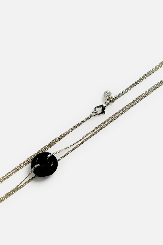 COLLIER PENDENTIF EN MATIÈRES VARIÉES