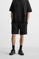 INTERLOCK STRUCTURED SHORTS