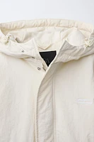 BLOUSON À CAPUCHE