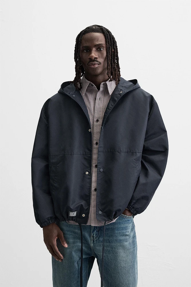 HOODED TECHNICAL JACKET