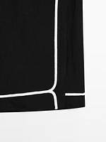 Jupe midi avec broderie contrastante
