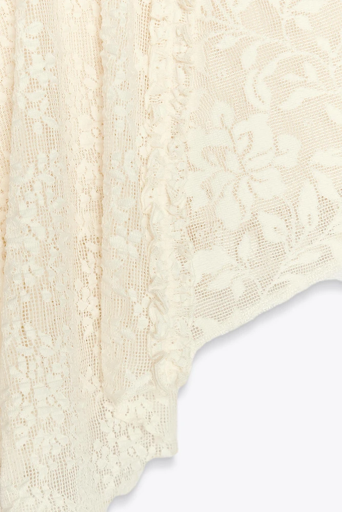 MINI-JUPE ASYMÉTRIQUE EN DENTELLE