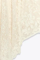 MINI-JUPE ASYMÉTRIQUE EN DENTELLE