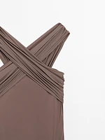 Bandeau swimsuit with criss-cross straps