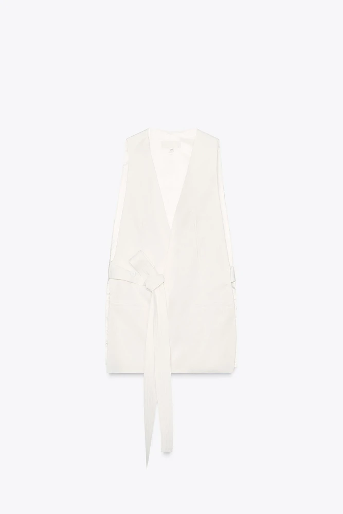 GILET LONG FENTES CEINTURE POSITIONS MULTIPLES
