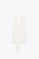 GILET LONG FENTES CEINTURE POSITIONS MULTIPLES