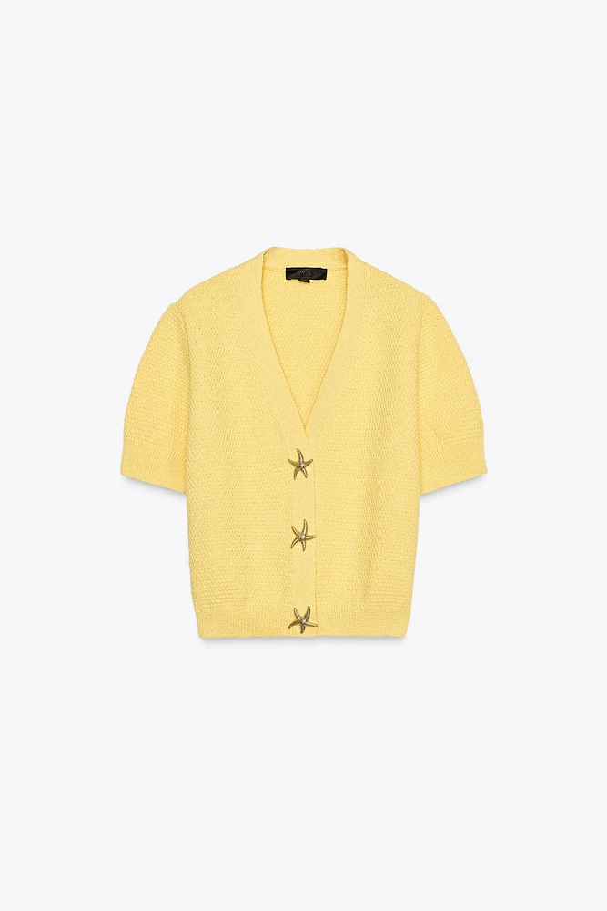GILET EN MAILLE BOUTON ÉTOILE