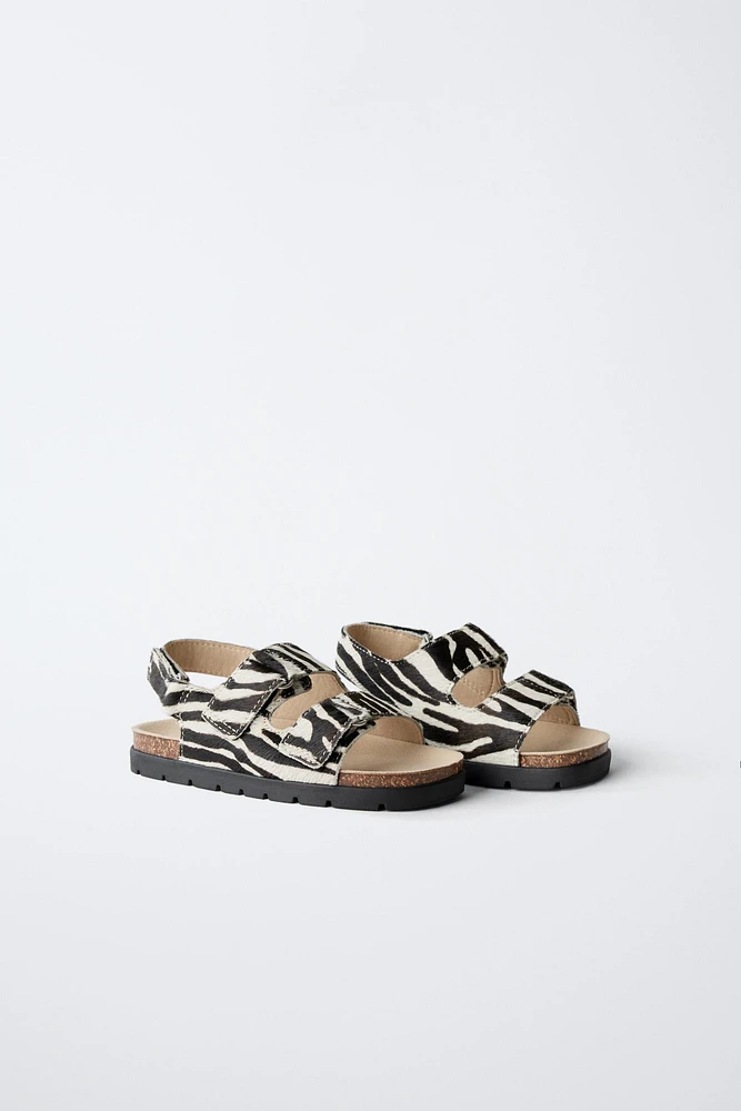 SANDALES EN CUIR ANIMAL PRINT