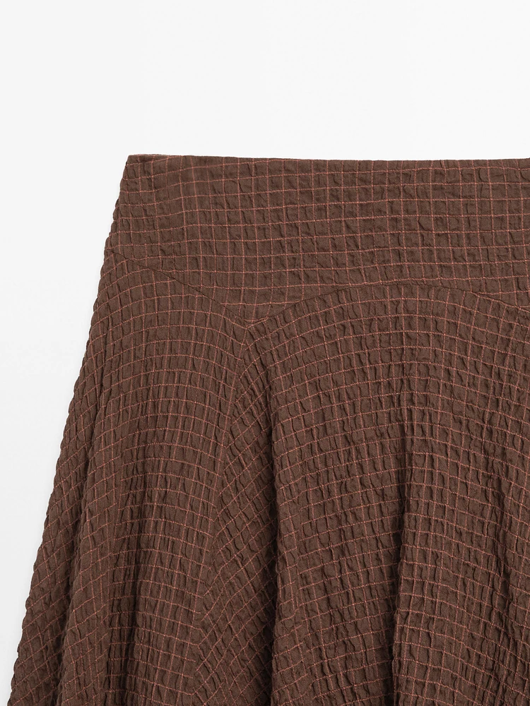 Jupe fluide à carreaux bas asymétrique