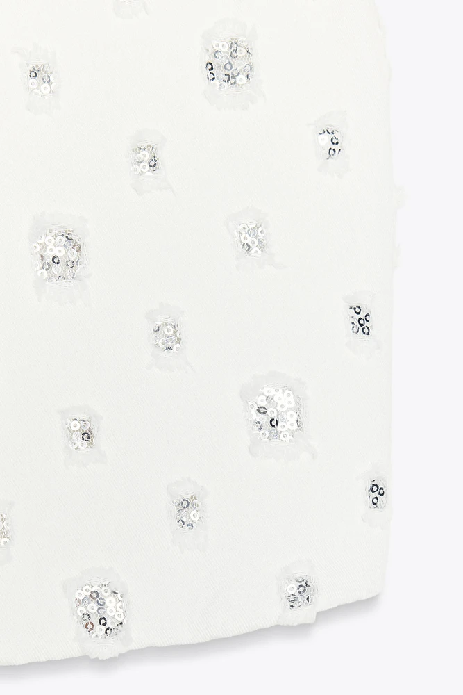 GILET COURT À SEQUINS