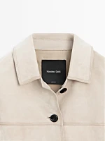 Veste courte à surpiqûres en cuir finition daim