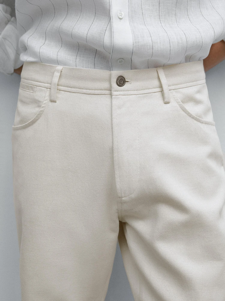 Cotton blend tapered fit denim trousers
