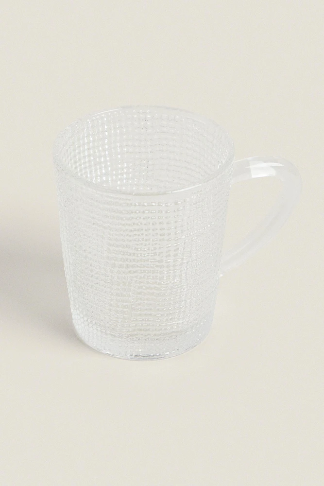 GLASS CUP WITH RAISED DESIGN