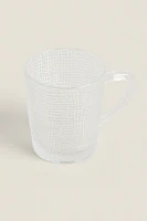 GLASS CUP WITH RAISED DESIGN