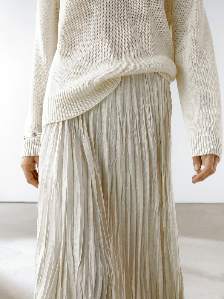 Flowing midi skirt with box pleats
