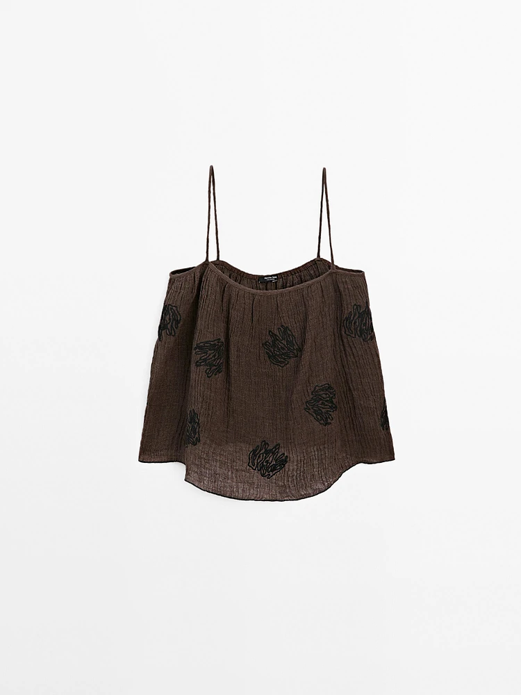 Flowing textured top with embroidered detail