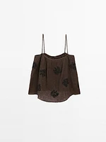 Flowing textured top with embroidered detail