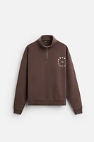 TEXT QUARTER ZIP SWEATSHIRT