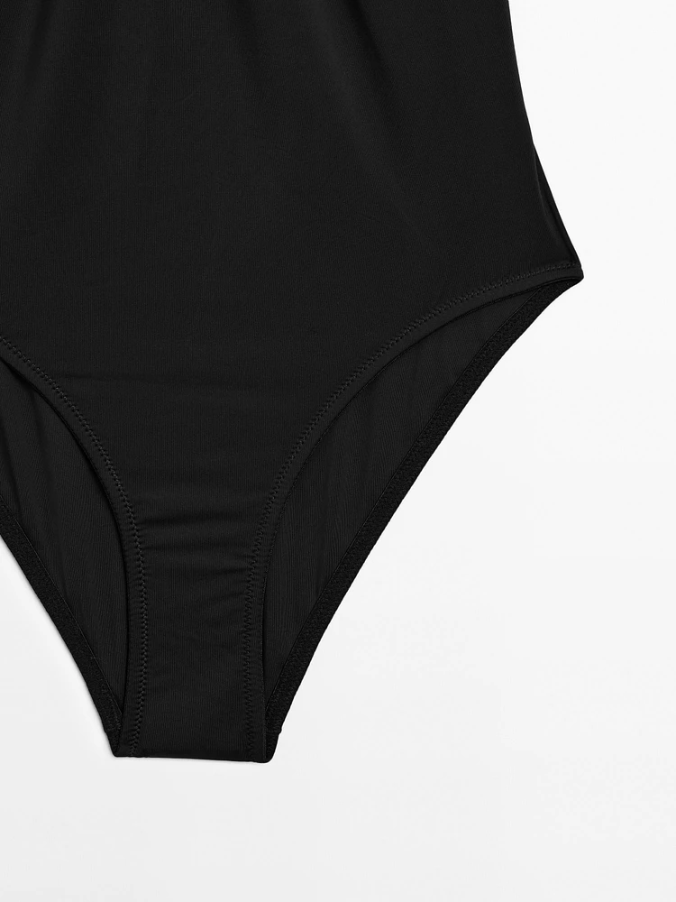 Bandeau swimsuit with metal piece detail