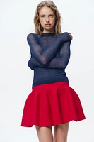 TOP EN MAILLE SEMI-TRANSPARENT