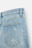 JEANS SKINNY AVEC DÉCHIRURES ET ÉCLABOUSSURES