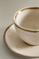 PORCELAIN TEACUP WITH ANTIQUE FINISH RIM