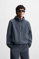 HOODED TECHNICAL JACKET