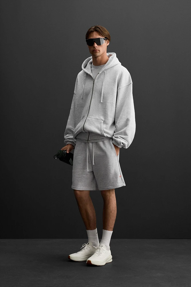SWEAT À CAPUCHE ET ZIP