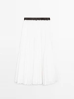 Pleated skirt with leather detail