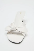 LEATHER BOW HEELED SANDALS