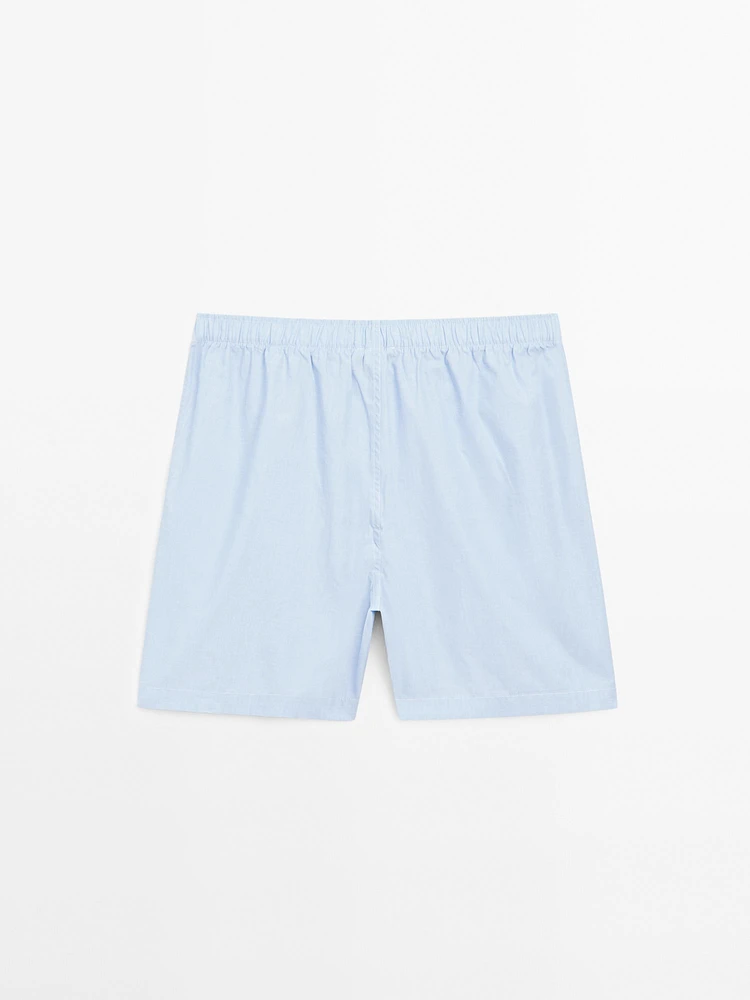 Short sleeve pyjama top and striped trousers