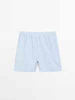 Short sleeve pyjama top and striped trousers