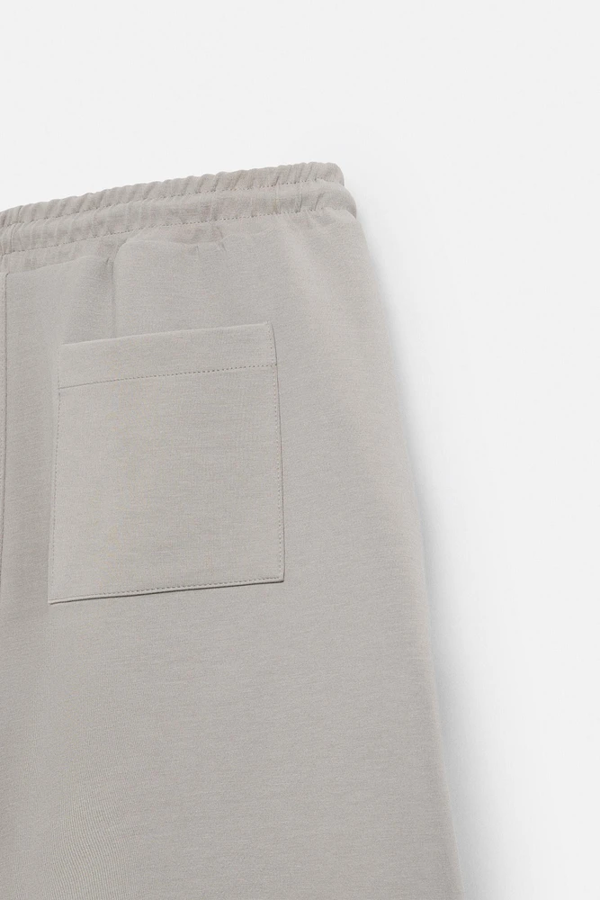 BERMUDA DE JOGGING OVERSIZE TECHNIQUE