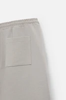 BERMUDA DE JOGGING OVERSIZE TECHNIQUE