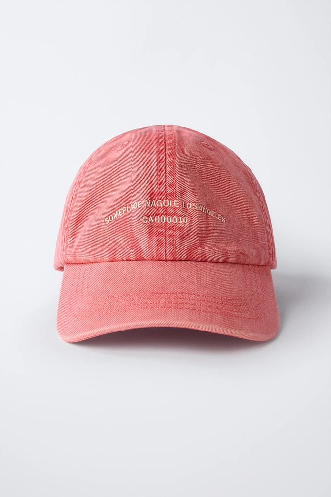 WASHED EFFECT CAP WITH EMBROIDERED TEXT