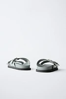 PATENT LEATHER BUCKLE SANDALS