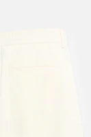 PLEATED CHINO PANTS