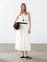 Pleated skirt with leather detail