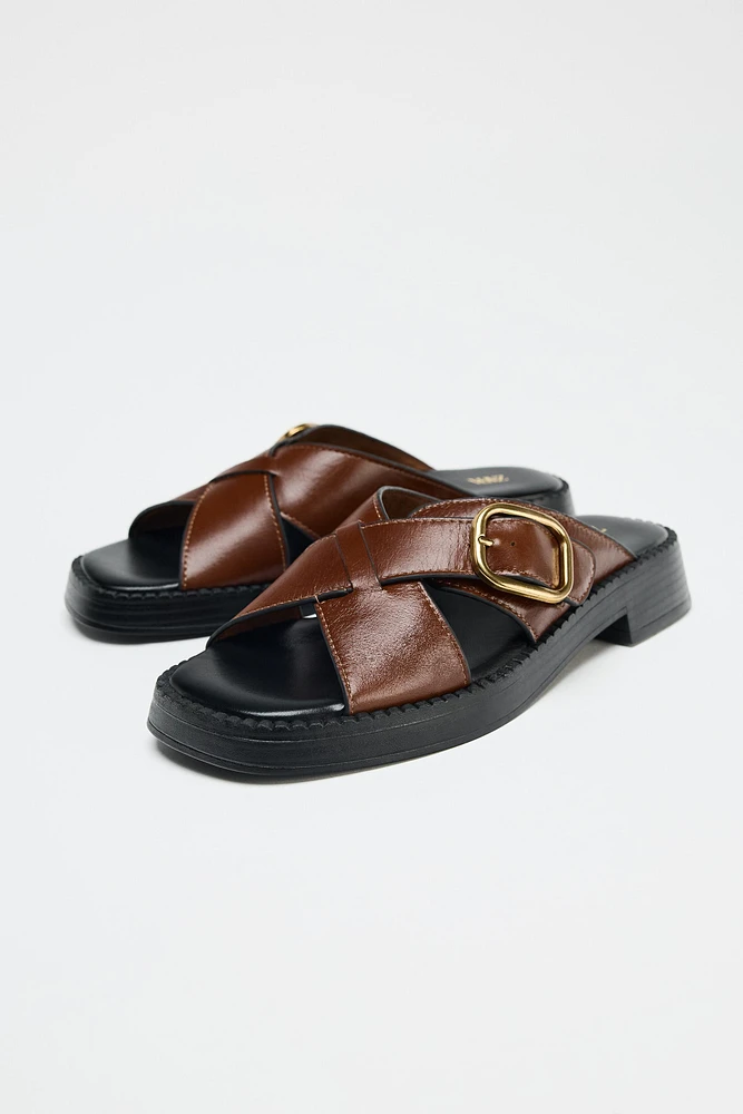 LEATHER CRISS CROSS BUCKLE SANDALS