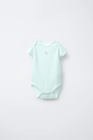 FIVE-PACK OF PATCHWORK BODYSUITS