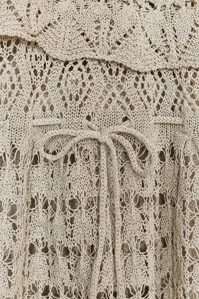 TOP EN MAILLE POINTELLE À VOLANTS